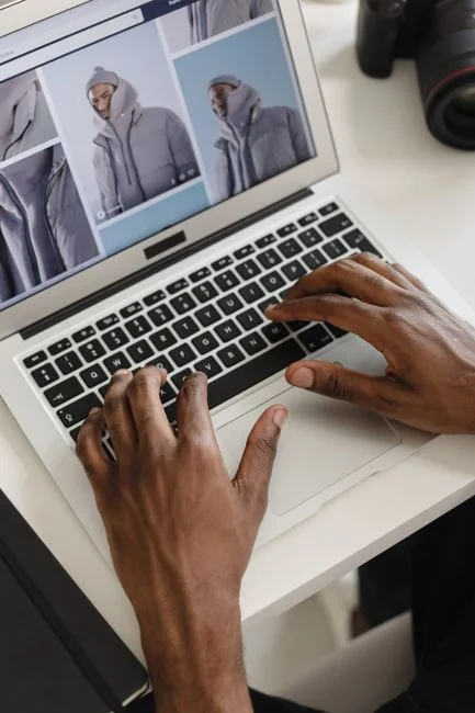 A person using a laptop to review social media marketing strategies at home.